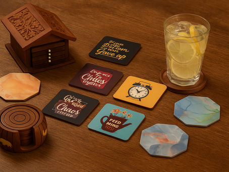aesthetic coaster sets neatly arranged on a wooden dining table with a lemon drink, warm lighting, and cozy party-desk vibe.