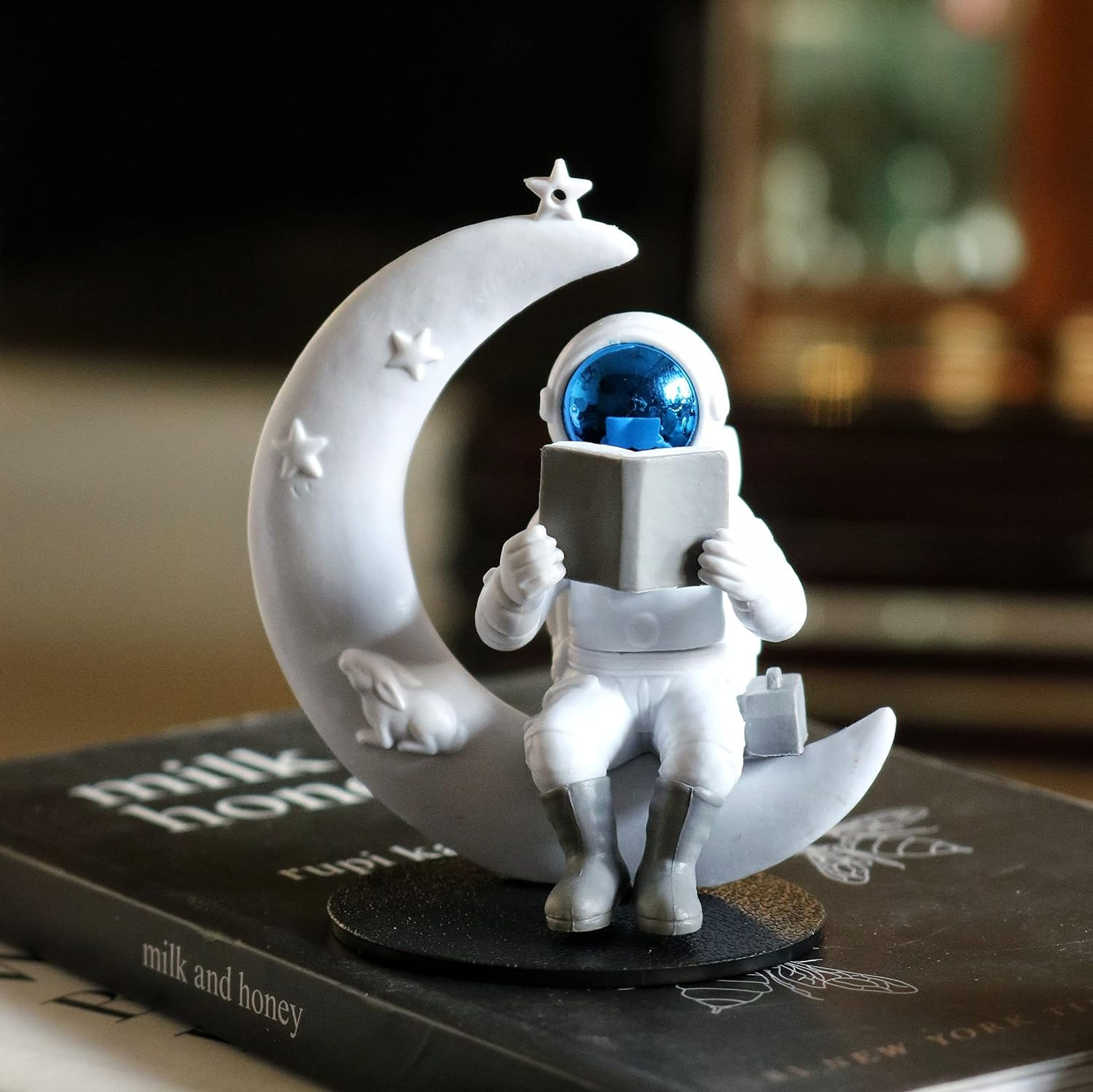 Astronaut figurine reading a book on a crescent moon, Lonely Lunar Traveller Figurine, decor.