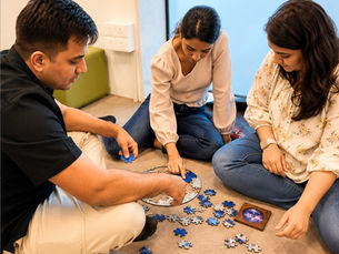 Friends solving a CircZles puzzle together, showing how Unique Diwali Gifts can create a social, screen-free festive experience.