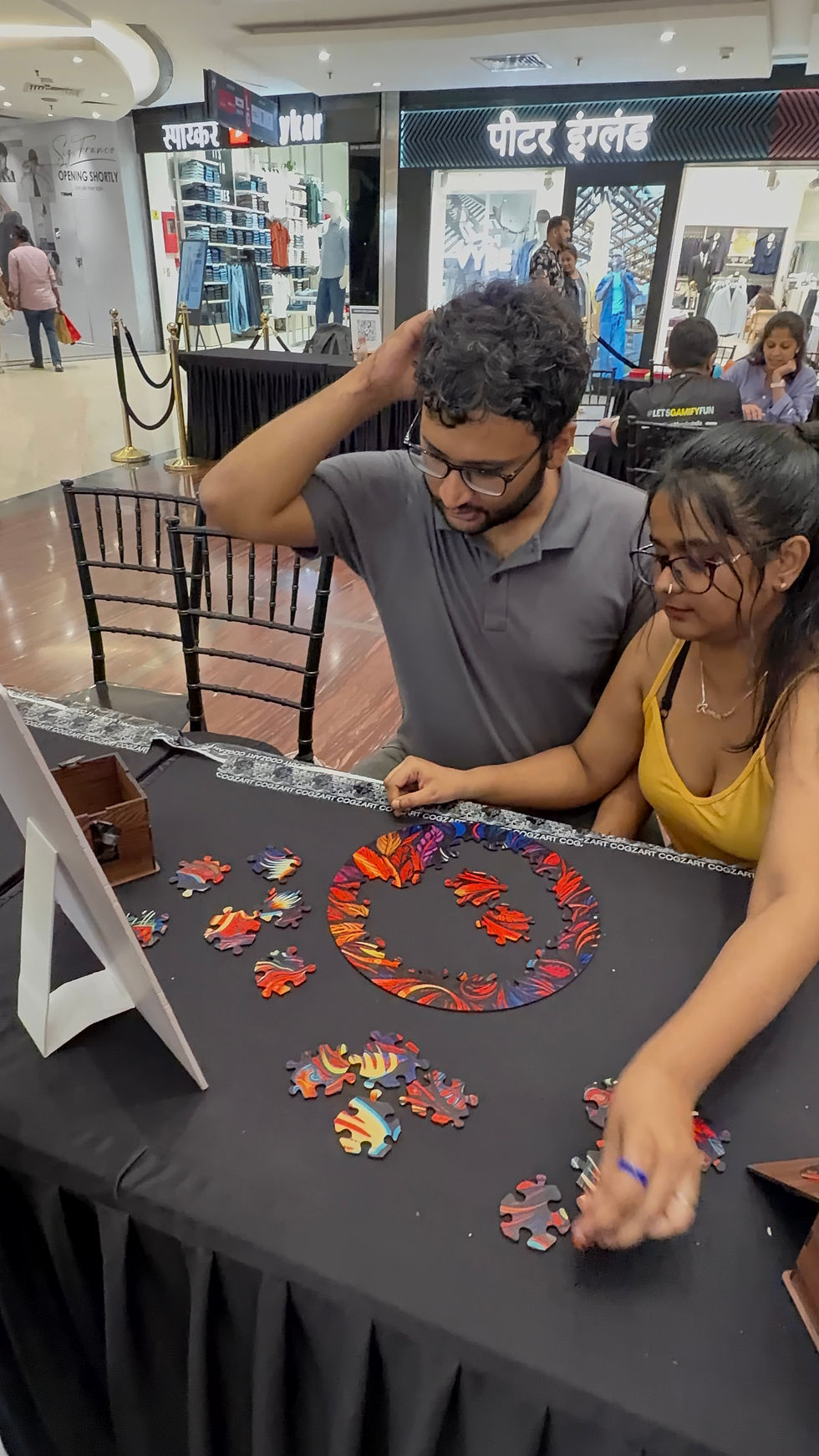 A couple solving a colorful CircZles puzzle together, highlighting couple games that encourage teamwork, conversation, and screen-free date night fun.