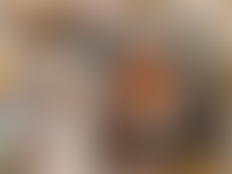 Colorful book titled "Unleash Your Inner Animal" with a tiger cover lies on a cozy table setting. Nearby are markers, stones, and a coffee cup.