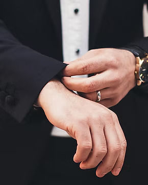 Man adjusting suit sleeve, premium corporate gifting and professional style concept