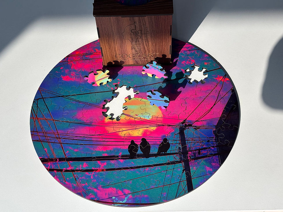 Round puzzle with vibrant pink and blue sunset, birds on wires, and five missing pieces. Wooden box labeled "Cognitive" in shadow.