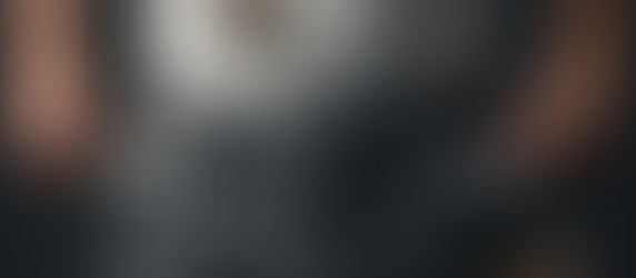 A man pulling out the insides of his pants pocket to show he has no money.