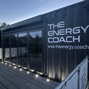 Modular container gym outside a school, used for PE equipment storage and student fitness activities, with outdoor training apparatus attached.