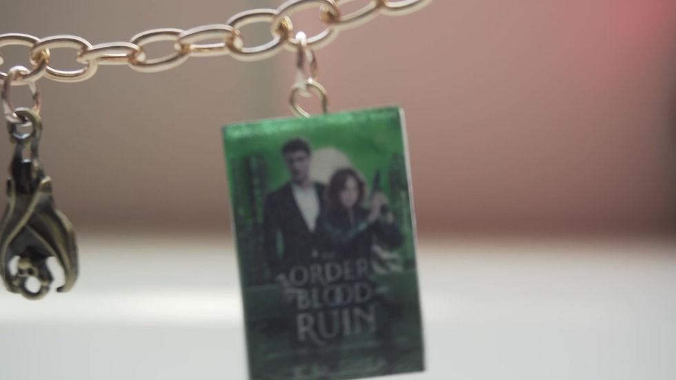Thumbnail: Bookish Charm Bracelet, KM Shea, Magic on Main Street