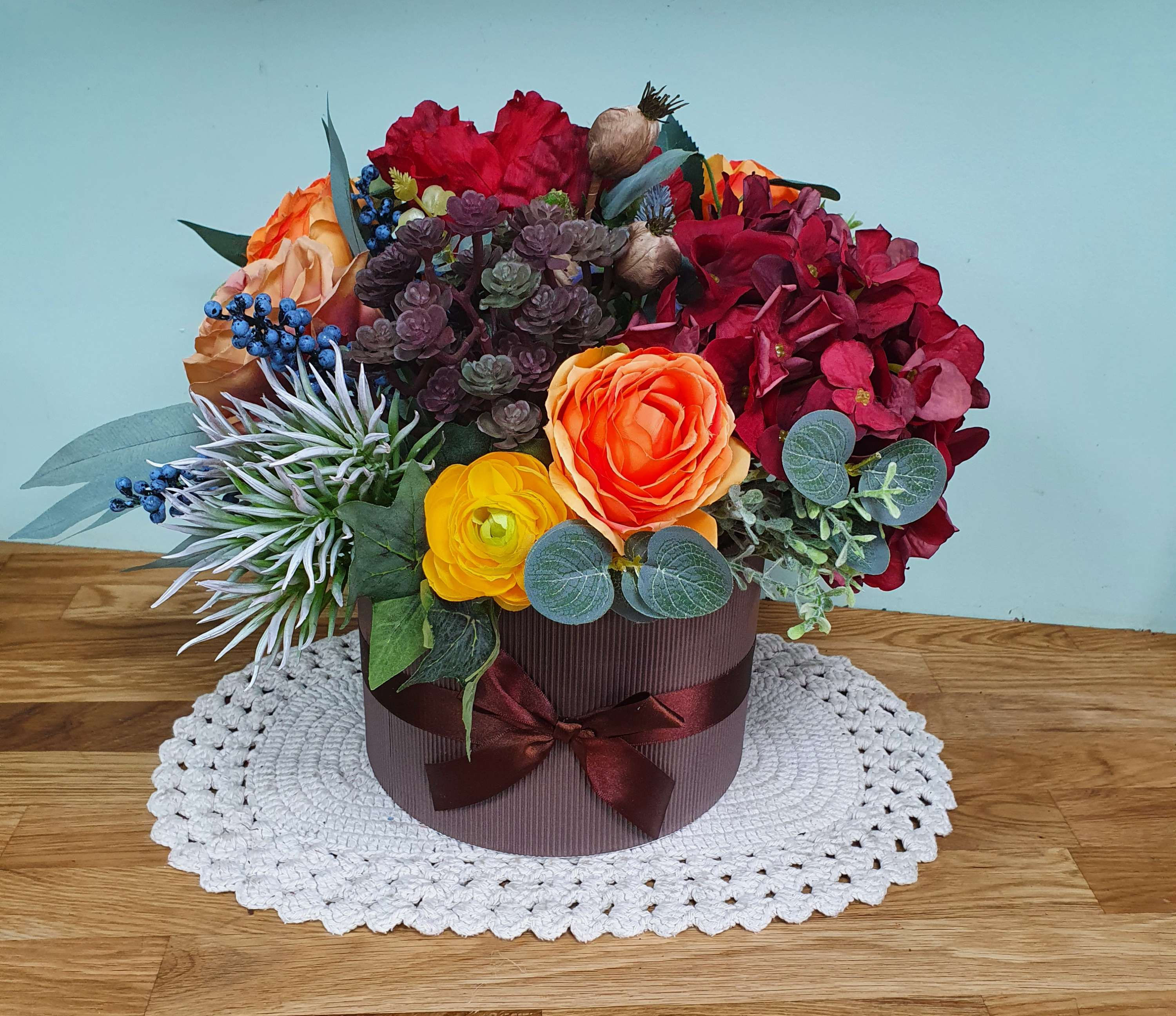 Artificial autumnal hatbox flower arrangement