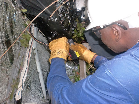 Aircraft accident investigator removing GPS from aircraft for data collection