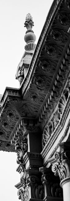 Ornate building with decorative and ornate columns and design, with white background