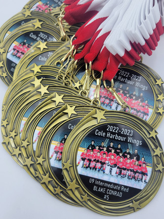 CH Wings U9 Team Photo Medals.jpg