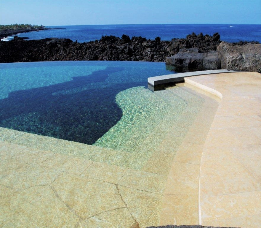 Plaza Gold natural building stone installed in a pool