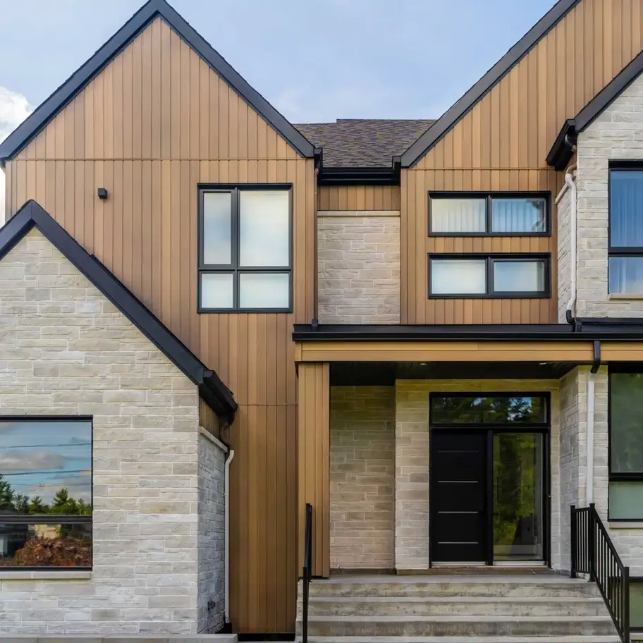 Home with vertical Norwood wood-tone siding and stone veneer