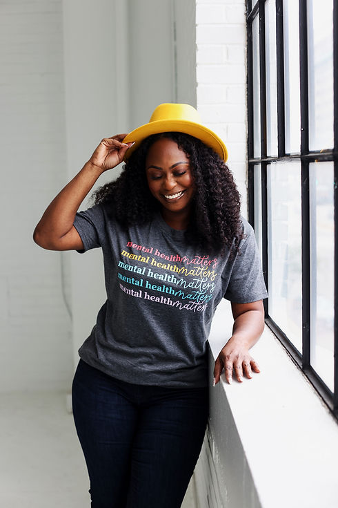 Picture of Dr. Y'Londa by the window.