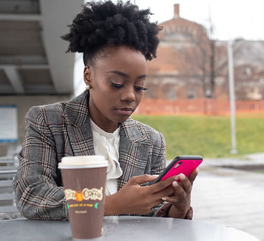 Black girl looking at cellphone