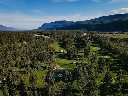 Aerial view of Spur Valley golf course nestled in mountains