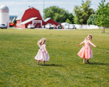 Little Girls Playing Outdoors in Custom-Made Dresses - Handmade Fashion for Kids