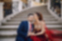 beautiful-woman-long-red-dress-walks-around-city-with-her-husband.jpg