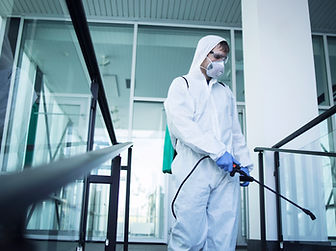 shot-male-person-white-chemical-protection-suit-doing-disinfection-public-areas-stop-sprea