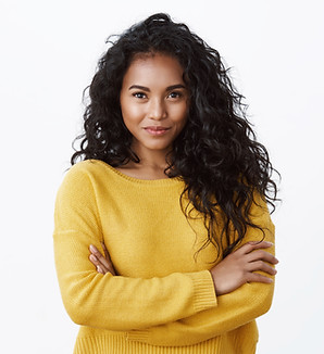 alluring-young-african-american-female-with-dark-curly-hairstyle-smiling-determined-motiva