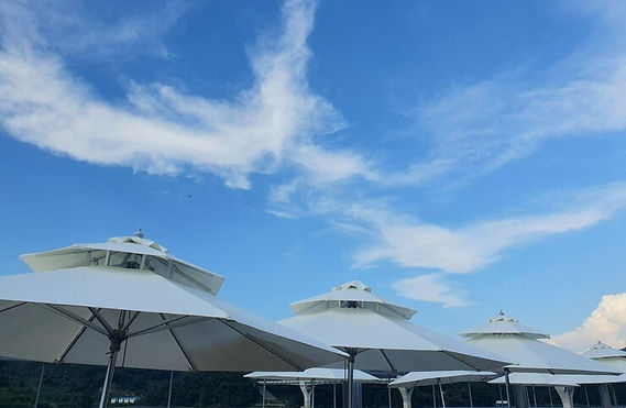 gazebo-by-building-against-blue-sky_1048944-28934331.jpg