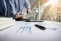 business-adviser-analyzing-financial-figures-denoting-progress-work-company