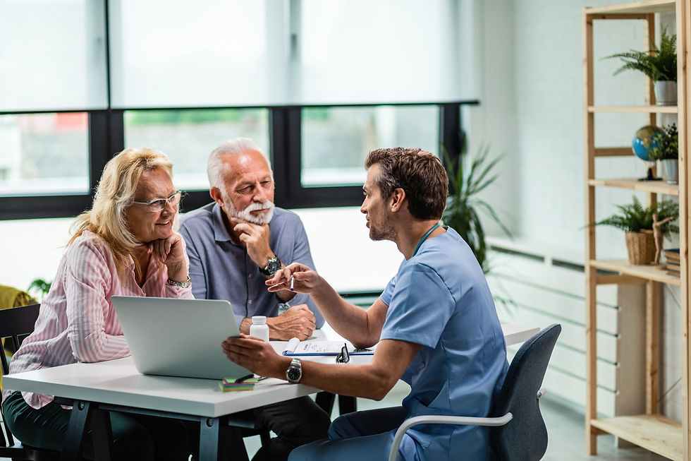 happy-mature-couple-their-doctor-communicating-while-using-laptop-medical-appointment.jpg