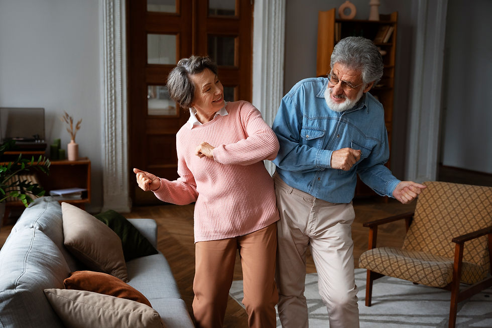 old couple dancing home medium shot