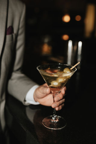 Signature martini with olives served during a luxury wedding reception at Rare650 on Long Island, planned by Blueprint Events Co. NY.