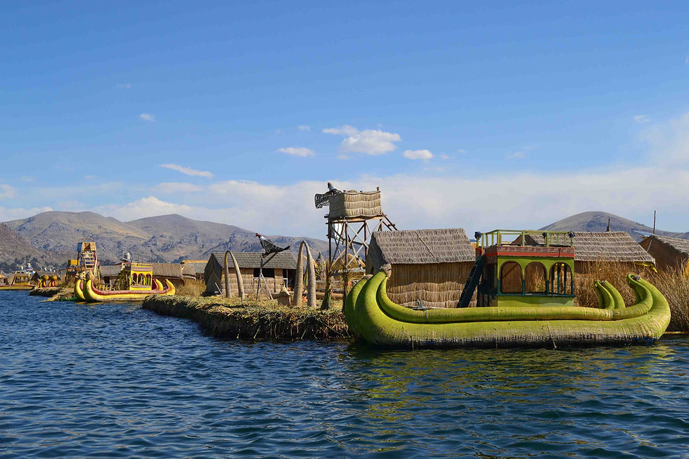 view of Uros artificial floating Islands in Lake Titicaca, Peru with traditional totora boats
