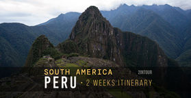 Machu Picchu archaeological site aerial view, with Huayna Picchu mountain behind