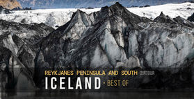 Sólheimajökull glacier with grey and black colouring of parts of the glacier caused by volcanic ash and sand that have settled on its surface over time