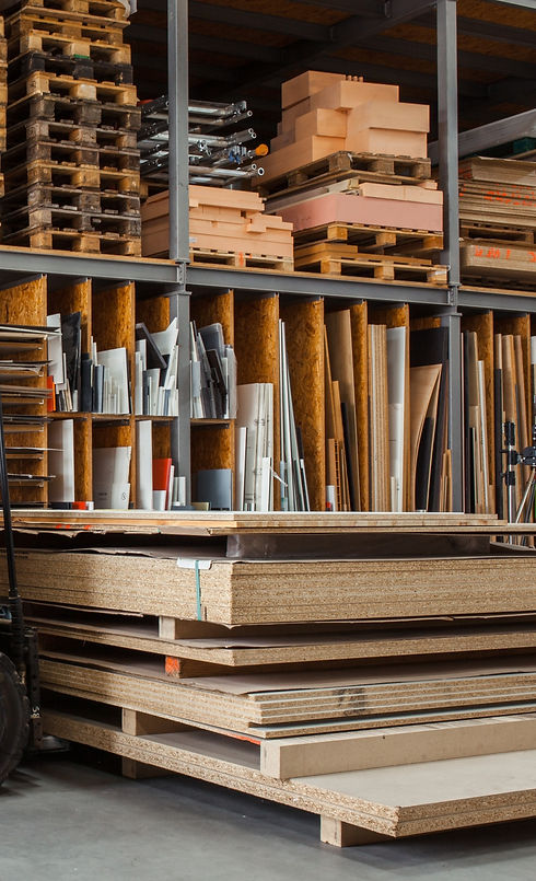 Worker%20with%20a%20forklift%20in%20a%20large%20carpentry%20workshop%20with%20many%20timbers%20in%20