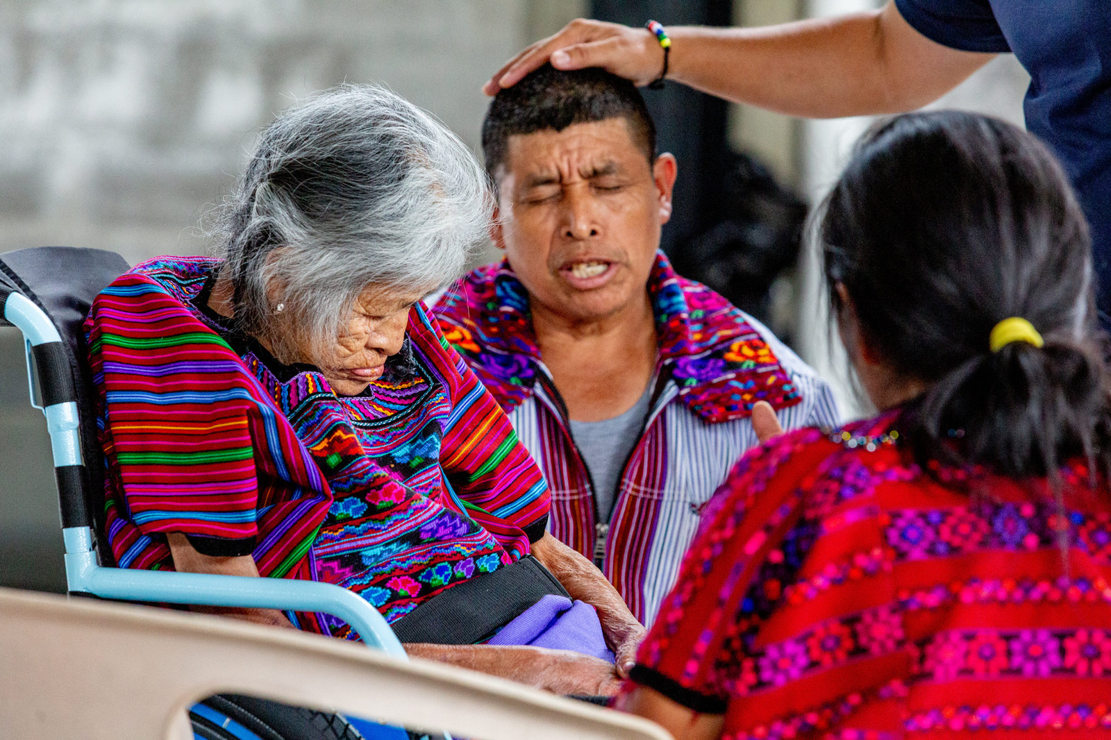 A moment of prayer and care, from Bethel Ministries International’s published ministry photography