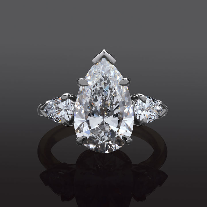 Stunning Pear Diamond set in a White Gold Ring in a moody setting.