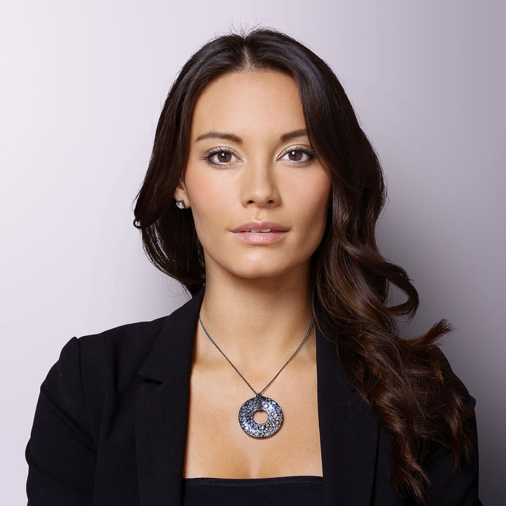 Beautiful girl wearing a Glass round Pendant.