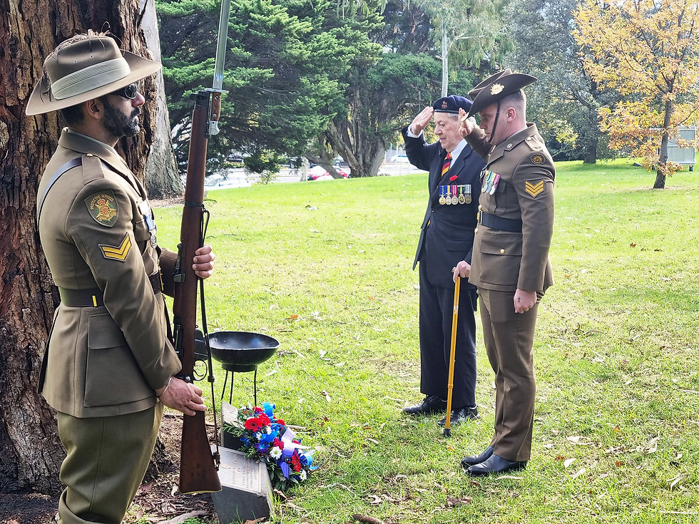Brigadier Bavington (Retd) and Sgt Tobi Griffiths lay flowers at the memorial tree plaque.