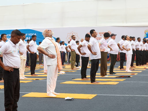 PM Narendra Modi and participants perform yoga asanas during International Yoga Day celebrations, highlighting the ancient practice's role in promoting physical and mental well-being. (Image Source: X/PM Modi)