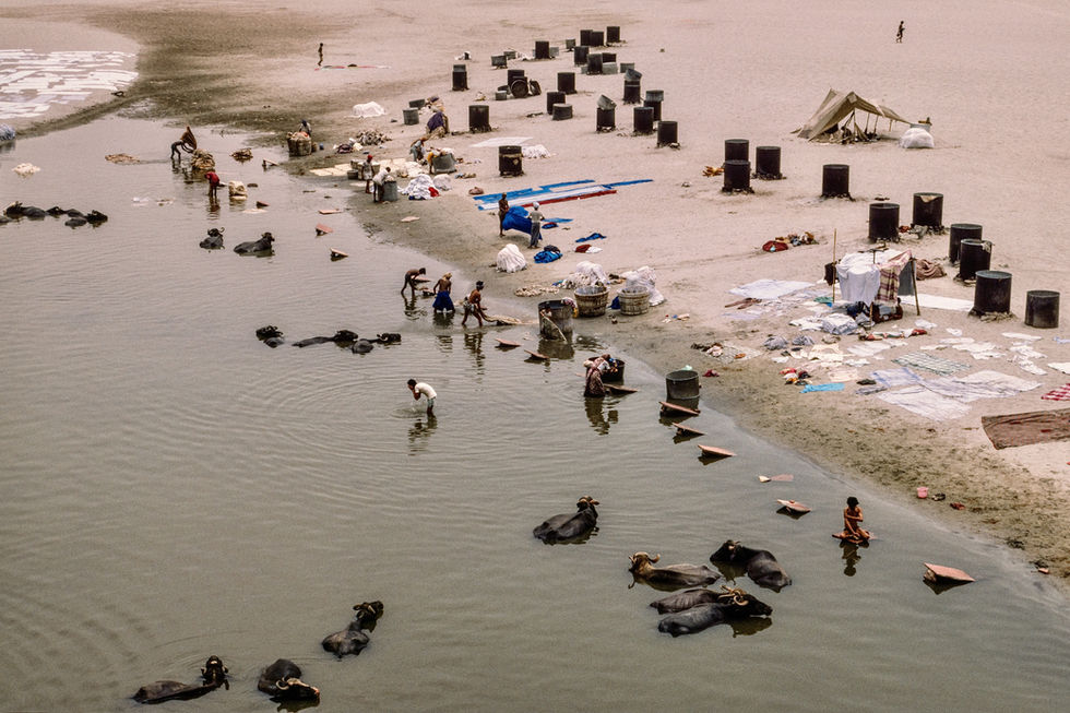 Professional washermen wash for their customers on the banks of the Yamuna river in Agra. India, 1990.