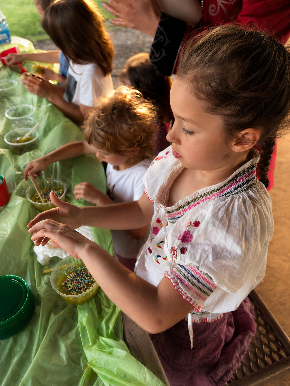  child playing with colorful slime