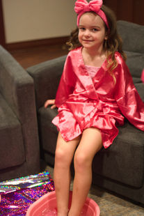 Girls smiling during a spa birthday celebration in Grayslake.