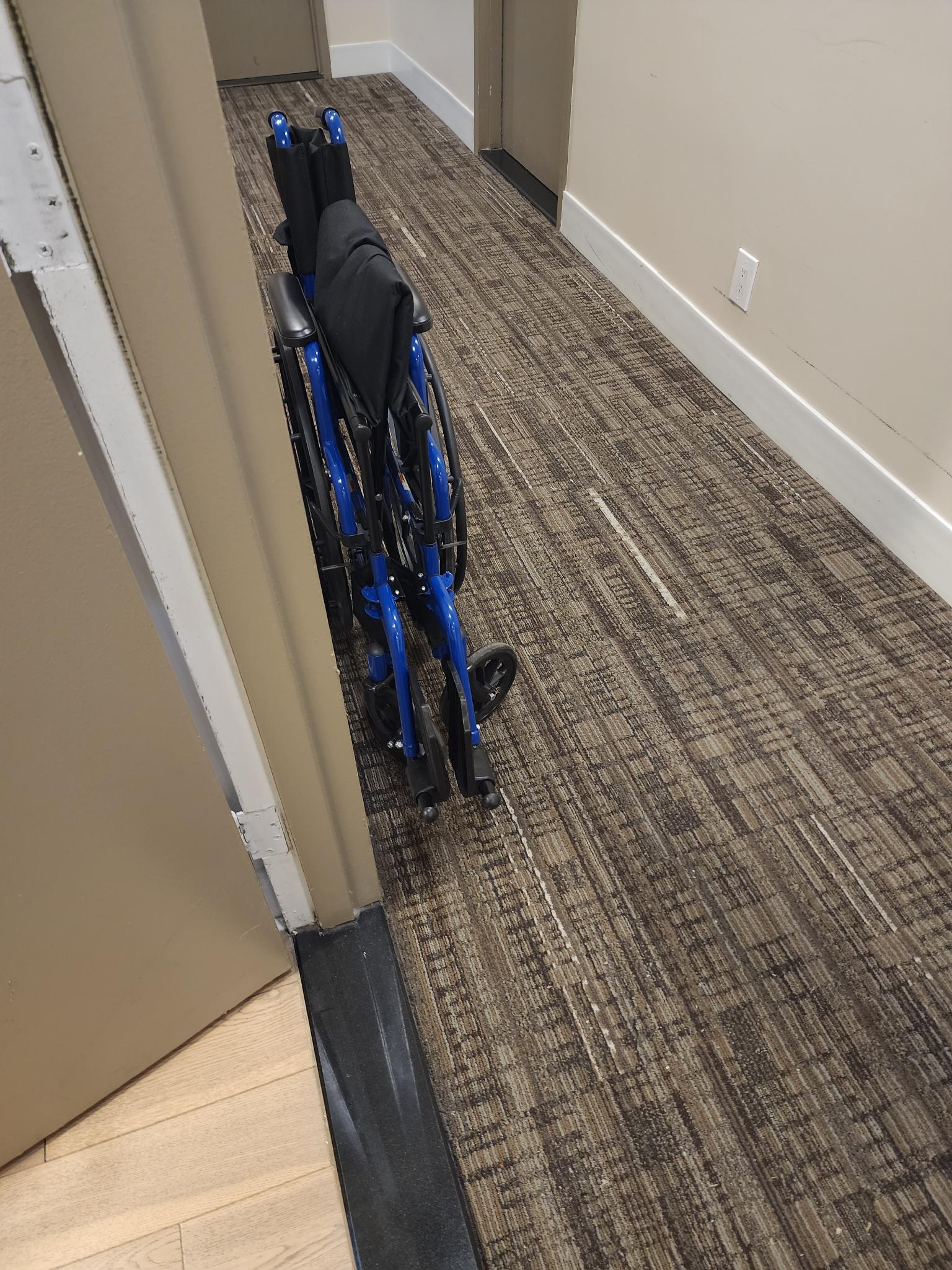 wheelchair stuck in the hall
