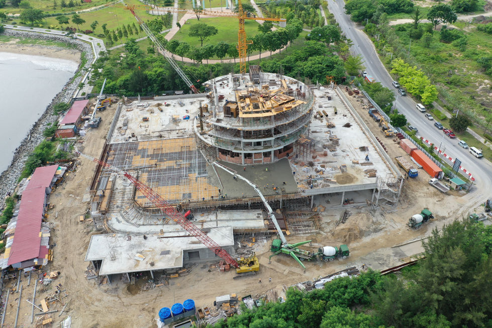 Circular building under construction with surrounding greenery Miri City Council Construction