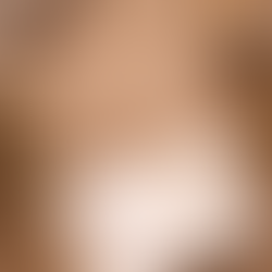 A calm lifestyle flat-lay scene featuring a notebook, pen, warm drink, and soft natural elements arranged on a neutral surface, evoking reflection, rest, and intentional living at the start of a new year.