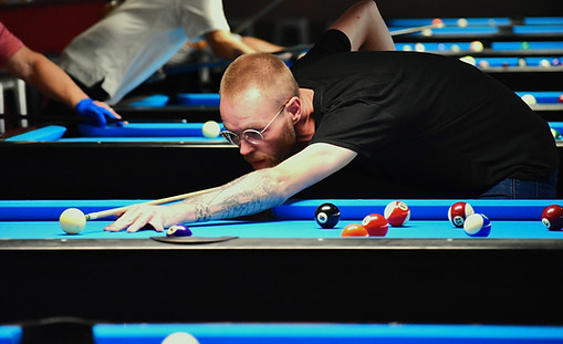 Billiards instructor Taylor plays in a tournament