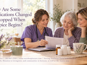 Hospice nurse reviews a medication list with an older woman and her daughter at a table with medicine bottles.