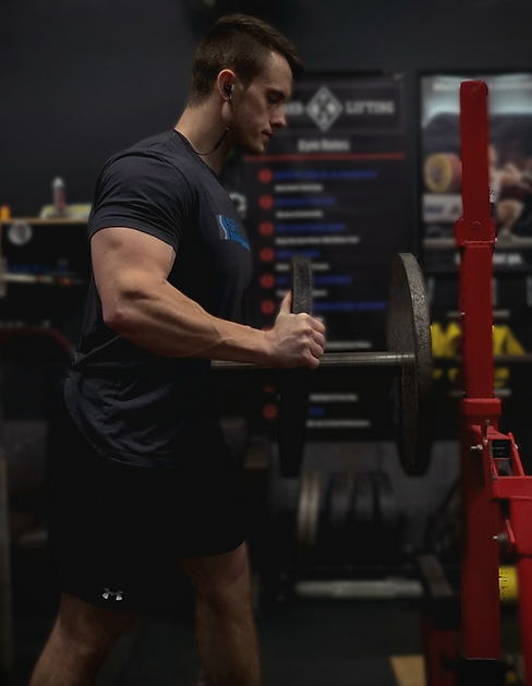 Dr. Tyler Campbell loading bench press