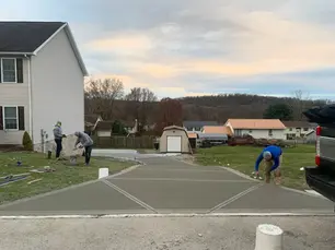 Professional concrete driveway installation in Pittsburgh showcasing expert craftsmanship and modern design