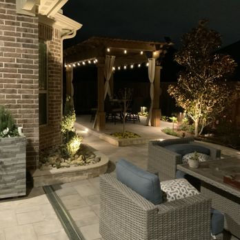 Luxury outdoor living space with patio, landscape lighting, pergola, and hardscape features by Elite Pros in Santa Ynez, California.