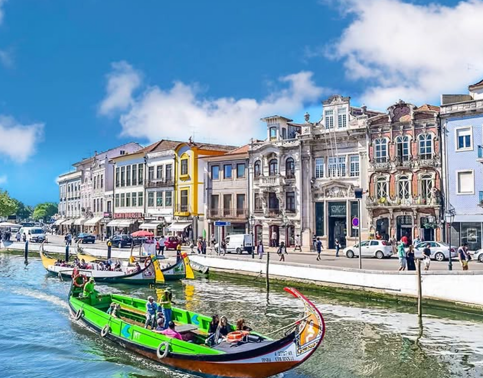 Colorful gondolas with passengers glide along a canal, framed by ornate European buildings under a clear blue sky.