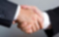 Two businessmen shaking hands, symbolizing trust, partnership, and the successful completion of a deal.